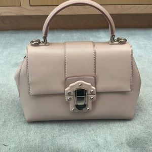 Soft pink. The bag was purchased in Milan, Italy.